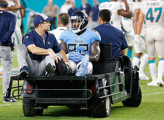 Titans tight end Delanie Walker is driven off the field after he injured his leg, during a game this season against the Dolphins, in Miami Gardens, Fla. 