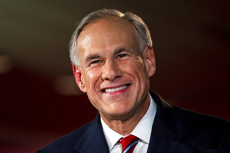 In this Sept. 28, 2018 file photo, Texas republican Gov. Greg Abbott smiles before a gubernatorial debate against his Democratic challenger Lupe Valdez at the LBJ Library in Austin, Texas. 