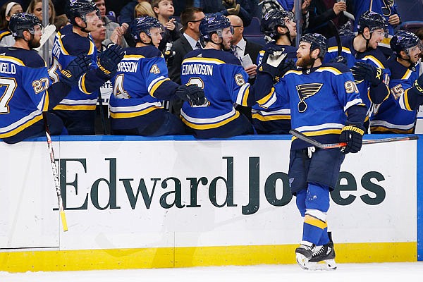 Ryan O'Reilly is congratulated by Blues teammates after scoring a goal during the first period of Tuesday night's game against the Hurricanes in St. Louis.