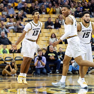 Missouri's Javon Pickett has the ball knocked away by Central Arkansas' SK Shittu (right) during the first half of Tuesday night's game at Mizzou Arena.