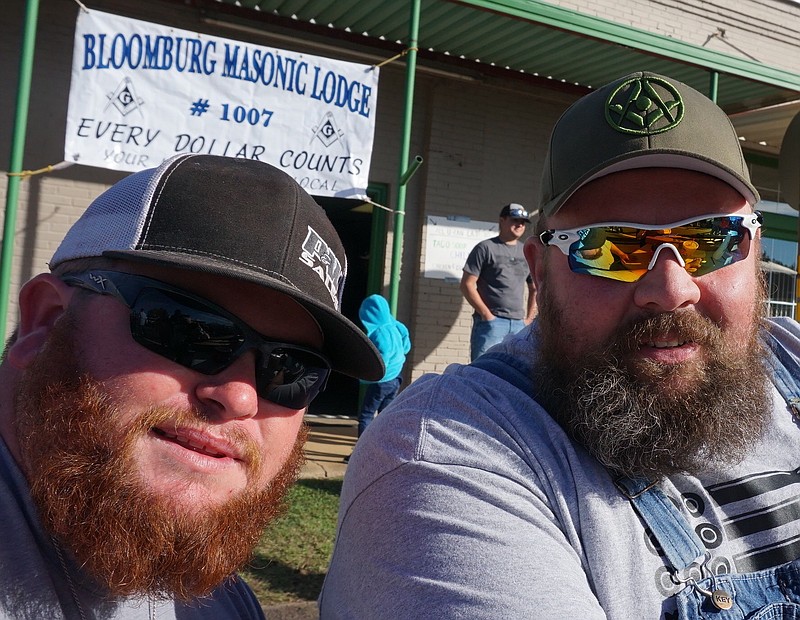 Here's just the look for locals Kevin Alexander, left, and Dylan Burney—cap, sunglasses and full beards.
