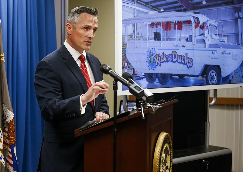 Tim Garrison, right, United States Attorney for the Western District of Missouri, speaks during a press conference on Thursday, Nov. 8, 2018 in Springfield, Mo., about the indictments against  Kenneth Scott McKee, the captain of a duck boat that sank on Table Rock Lake in July,  killing 17 people. (Andrew Jansen/The Springfield News-Leader via AP)