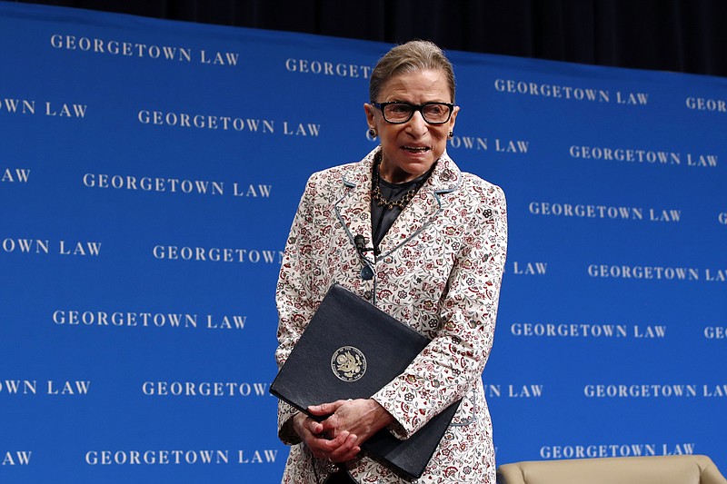 FILE - In this Sept. 26, 2018, file photo, Supreme Court Justice Ruth Bader Ginsburg leaves the stage after speaking to first-year students at Georgetown Law in Washington. Ginsburg has been hospitalized after fracturing three ribs in fall at court (AP Photo/Jacquelyn Martin, File)