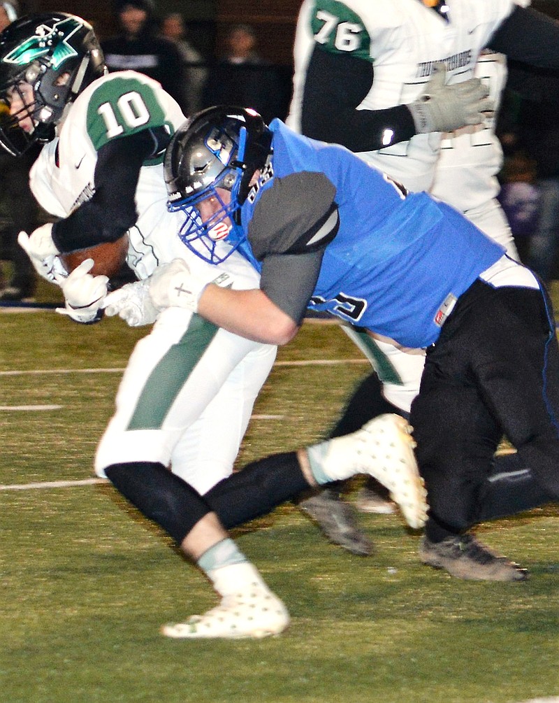 South Callaway senior defensive lineman Dustin Loucks tries to drag down North Callaway senior wide receiver Chet Cunningham from behind in the Bulldogs' 14-6 victory over the Thunderbirds in the Class 2, District 5 semifinals Nov. 2 in Mokane. No. 2 seed South Callaway (10-1) travels to Wardsville tonight to face top-seeded and No. 1-ranked Blair Oaks (11-0) for the District 5 championship.