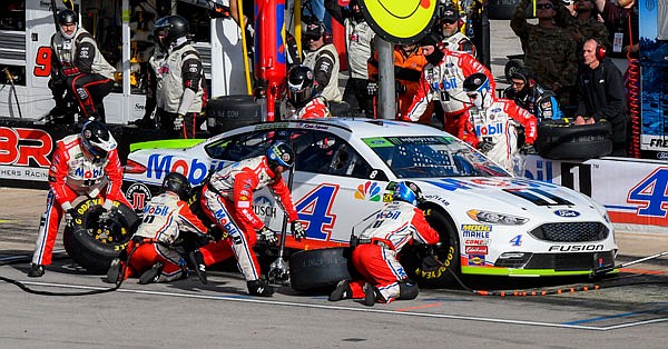 Kevin Harvick's pit crew works on his car during last Sunday's NASCAR Cup Series race at Texas Motor Speedway in Fort Worth, Texas.