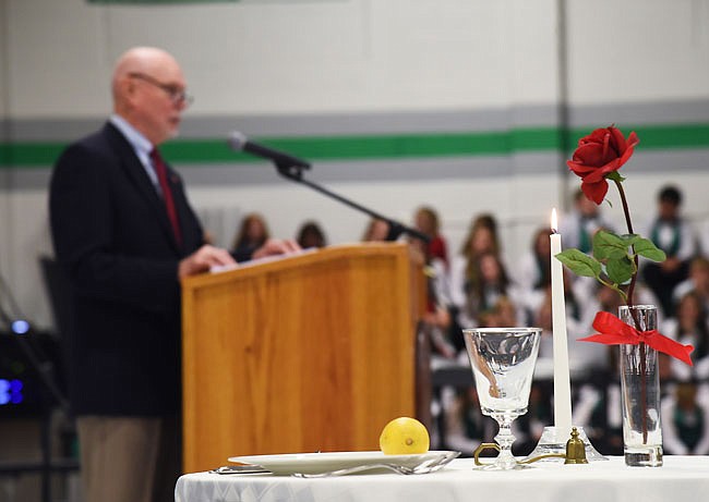 In the foreground is the POW/MIA table behind which Colonel (Retired) John W. Clark, speaks to Friday's gathering at the annual Blair Oaks Veterans Day program in the high school gymnasium. Two Blair Oaks R-2 school district teachers, Kelsey Luebbert and Jason Wise, were awarded the Smart/Maher VFW National Citizenship Education Teacher Award for 2019 at the program. 