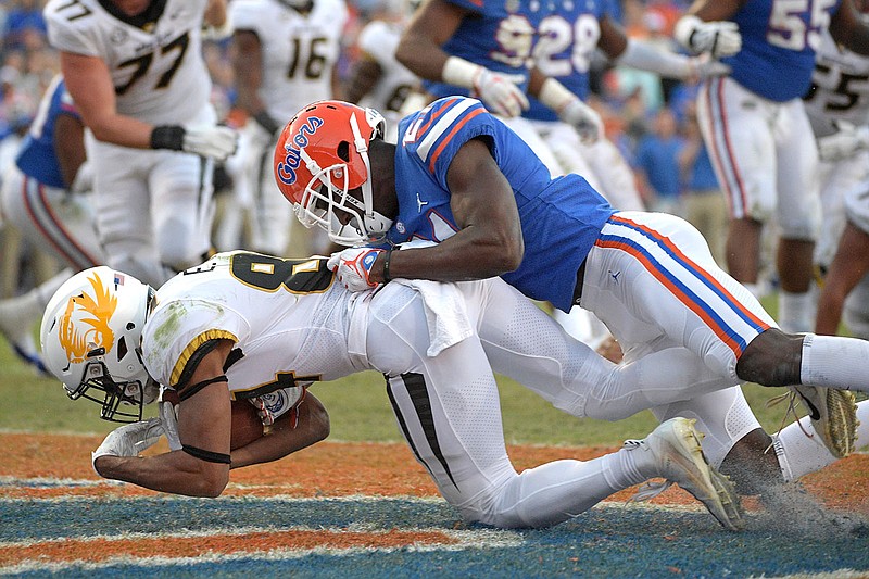 Missouri receiver Emanuel Hall catches a pass in the end zone in front of Florida defensive back Trey Dean III for a touchdown during last Saturday's game in Gainesville, Fla.