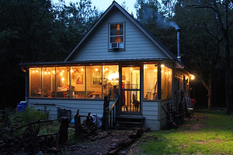 A cozy, small house in the Sutton community in Nevada County, Ark., is the perfect spot for a "retired" college professor who enjoys reading, walking the woods and "playing" on his tractor.(Photo by Meredith Piper Embry)
