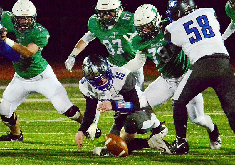 South Callaway Peyton Leeper tries to recover a fumble as Blair Oaks teammates Grant Laune (87) and Rylee Niekamp (79) close in on the play during Friday night's Class 2 District 5 championship game at  the Falcon Athletic Complex in Wardsville.