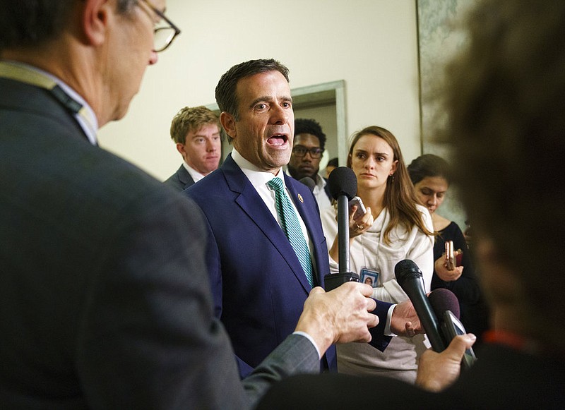 Rep. John Ratcliffe, R-Texas., pauses as he speaks to media on Capitol Hill in Washington, Thursday, Oct. 25, 2018. 