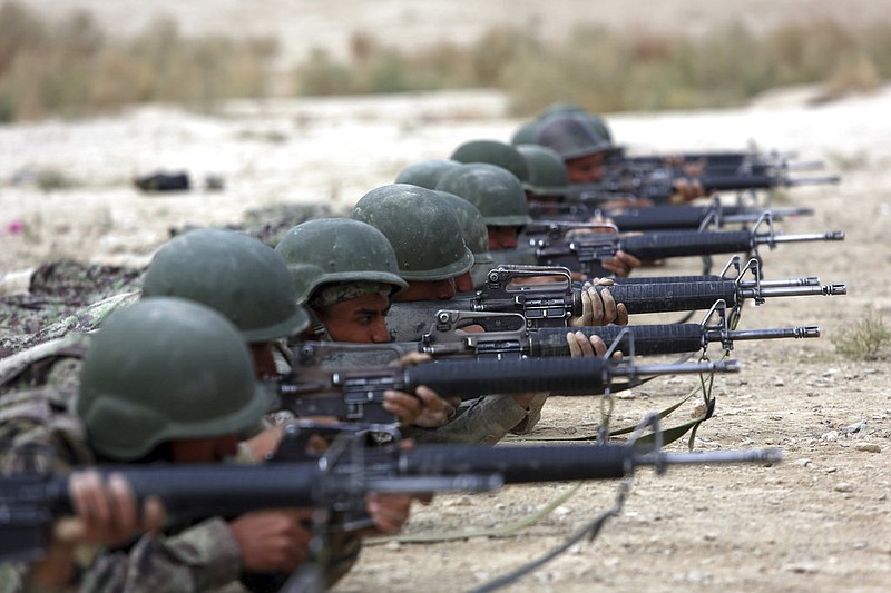 In this Oct. 31, 2018 photo, Afghan National Army soldiers participate in a live fire training exercise, at the Afghan Military Academy, in Kabul, Afghanistan. When U.S. forces and their Afghan allies rode into Kabul in November 2001 they were greeted as liberators. But after 17 years of war, the Taliban have retaken half the country, security is worse than it's ever been, and many Afghans place the blame squarely on the Americans. 