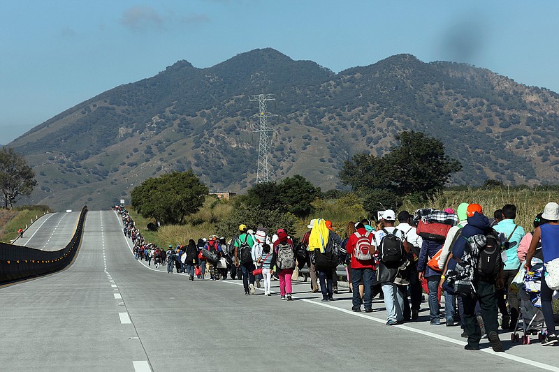Central American migrants travel as a caravan toward the U.S. border on the highway that connects Guadalajara with Tepic, Mexico, Tuesday, Nov. 13, 2018. Many migrants say they are fleeing rampant poverty, gang violence and political instability primarily in the Central American countries of Honduras, Guatemala, El Salvador and Nicaragua. (AP Photo/Rodrigo Abd)