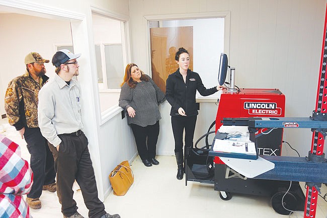 Representing Lincoln Electric, technical sales rep Karissa Culp shows a group how to use two new VRTEX virtual welding machines. A grand opening of the new Workforce Development Training Center will be 2:30 p.m. Monday in the offices in the rear of the Callaway Chamber building, 510 Market St. in Fulton. People can still sign up for free welding classes at the Missouri Job Center next door, or learn more at the grand opening.