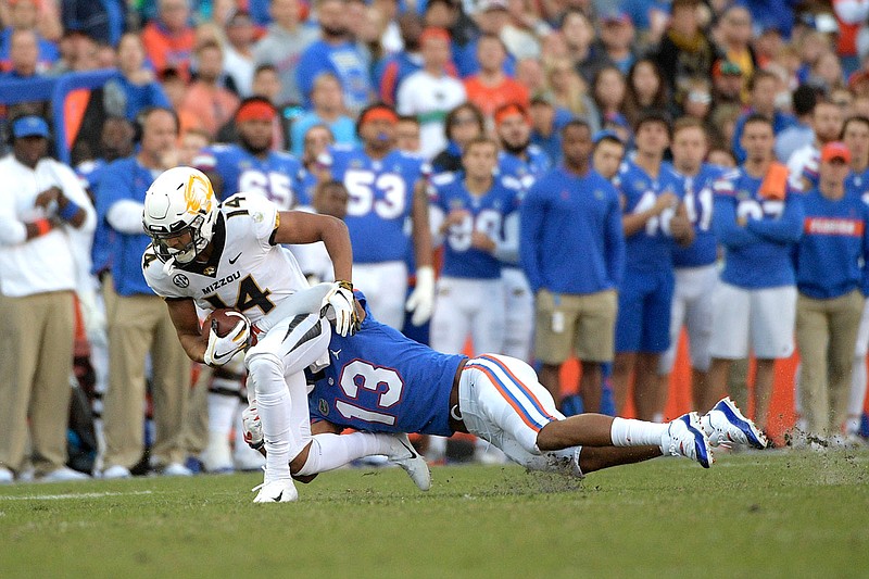 Missouri receiver Dominic Gicinto is tackled by Florida safety Donovan Stiner after catching a pass during a game earlier this month in Gainesville, Fla.