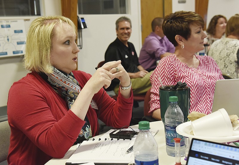 In this June 2018 file photo, Brenda Hatfield, left, Jefferson City Public Schools' director of quality improvement, and Lorie Rost, director of elementary education, listen during a diversity training session.