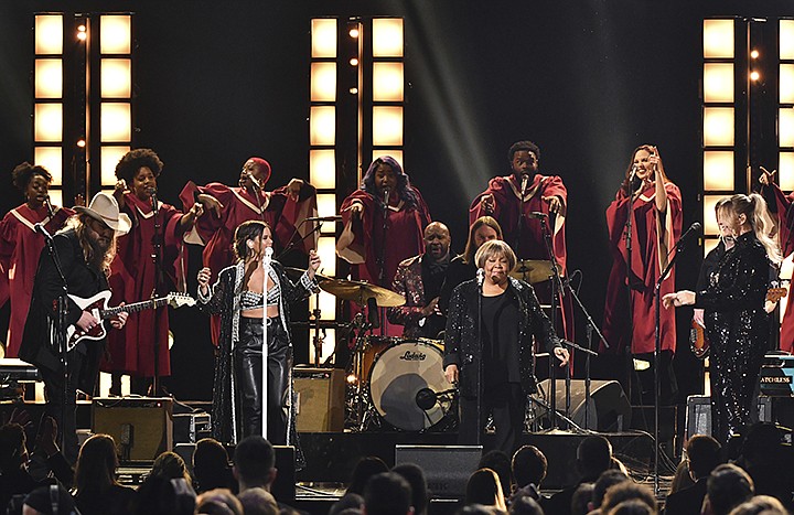 Chris Stapleton, from left, Maren Morris, Mavis Staples and Morgane Stapleton perform "I'll Take You There" at the 52nd annual CMA Awards at Bridgestone Arena on Wednesday, Nov. 14, 2018, in Nashville, Tenn. (Photo by Charles Sykes/Invision/AP)