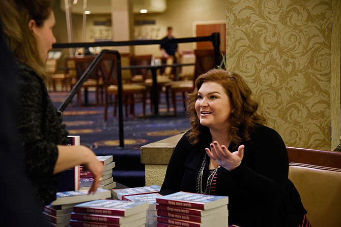 Ashely Rhodes-Courter talks to attendees of the Central Missouri Foster Care and Adoption Association's annual gala Thursday, Nov. 15, 2018, at the Capitol Plaza Hotel. Rhodes-Courter, an author, was the keynote speaker at the gala. She was adopted and has worked as a social worker.