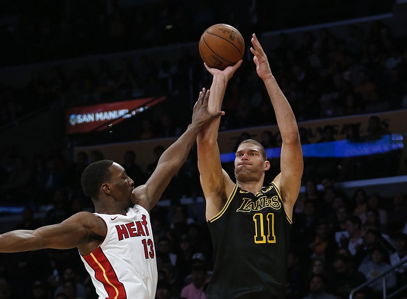  In this March 16, 2018, file photo, Los Angeles Lakers center Brook Lopez shoots over Miami Heat center Bam Adebayo during an NBA basketball game in Los Angeles. Entering the Bucks' game on Wednesday night, Nov. 14, 2018, against Memphis, Lopez was tied for seventh in the league in made 3s (39) and was 14th in attempts (93), shooting 41.9 percent from behind the arc.
(AP Photo/Ringo H.W. Chiu, File)