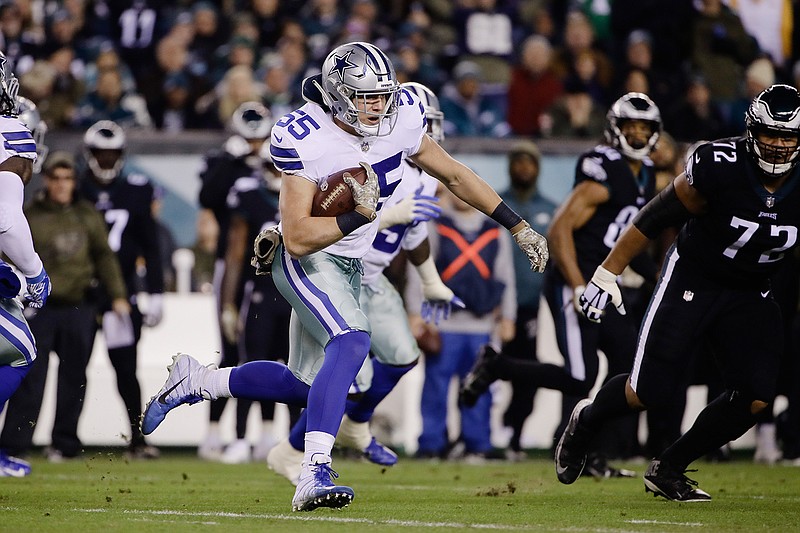 In this Sunday, Nov. 11, 2018, file photo, Dallas Cowboys outside linebacker Leighton Vander Esch, center, runs with the ball after intercepting a pass during the first half of an NFL football game against the Philadelphia Eagles in Philadelphia. Vander Esch has the Dallas rookie record for tackles in a game and the first interception by a first-year linebacker for the Cowboys since Sean Lee in eight years ago. (AP Photo/Matt Rourke, File)