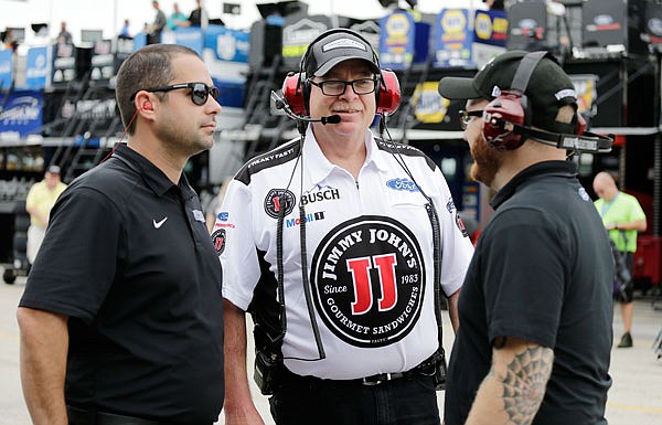 Tony Gibson, a crew chief for Stewart-Haas Racing, talks with crew members during Friday's practice for the NASCAR Cup Series race at the Homestead-Miami Speedway in Homestead, Fla. Gibson is filling in for suspended crew chief Rodney Childers on Kevin Harvick's No. 4 Ford this week.