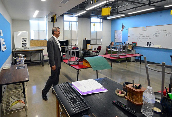 Jefferson City Public Schools CFO and COO Jason Hoffman takes a tour of a high school art classroom, which was previously home to the library. The library is now in a temporary location as renovations continue.
