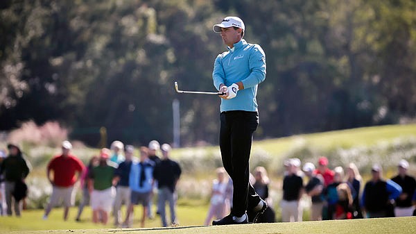 Charles Howell III watches his chip shot to the second green during Saturday's third round of the RSM Classic in St. Simons Island, Ga.