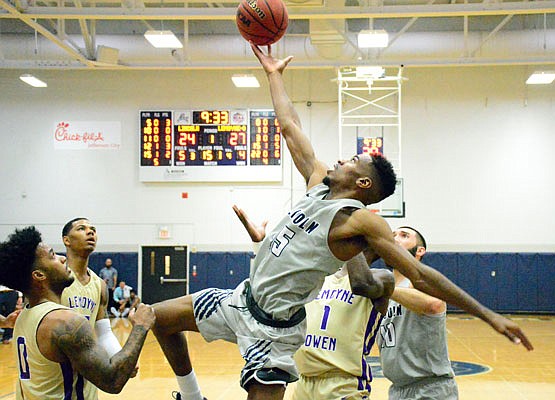 Jonell Burton of Lincoln reaches for a rebound during Saturday afternoon's game against LeMoyne-Owen at Jason Gym.
