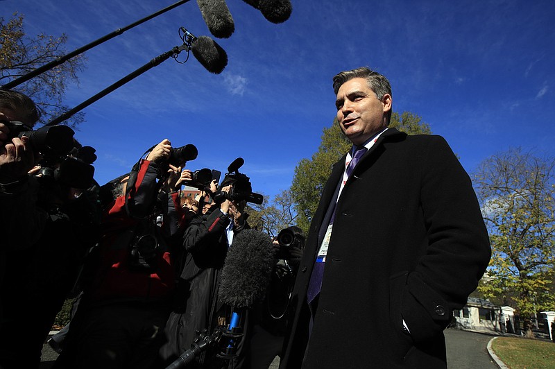 CNN's Jim Acosta speaks to journalists on the North Lawn upon returning back to the White House in Washington, Friday, Nov. 16, 2018. U.S. District Court Judge Timothy Kelly ordered the White House to immediately return Acosta’s credentials. He found that Acosta was “irreparably harmed” and dismissed the government’s argument that CNN could send another reporter in Acosta’s place to cover the White House. (AP Photo/Manuel Balce Ceneta)