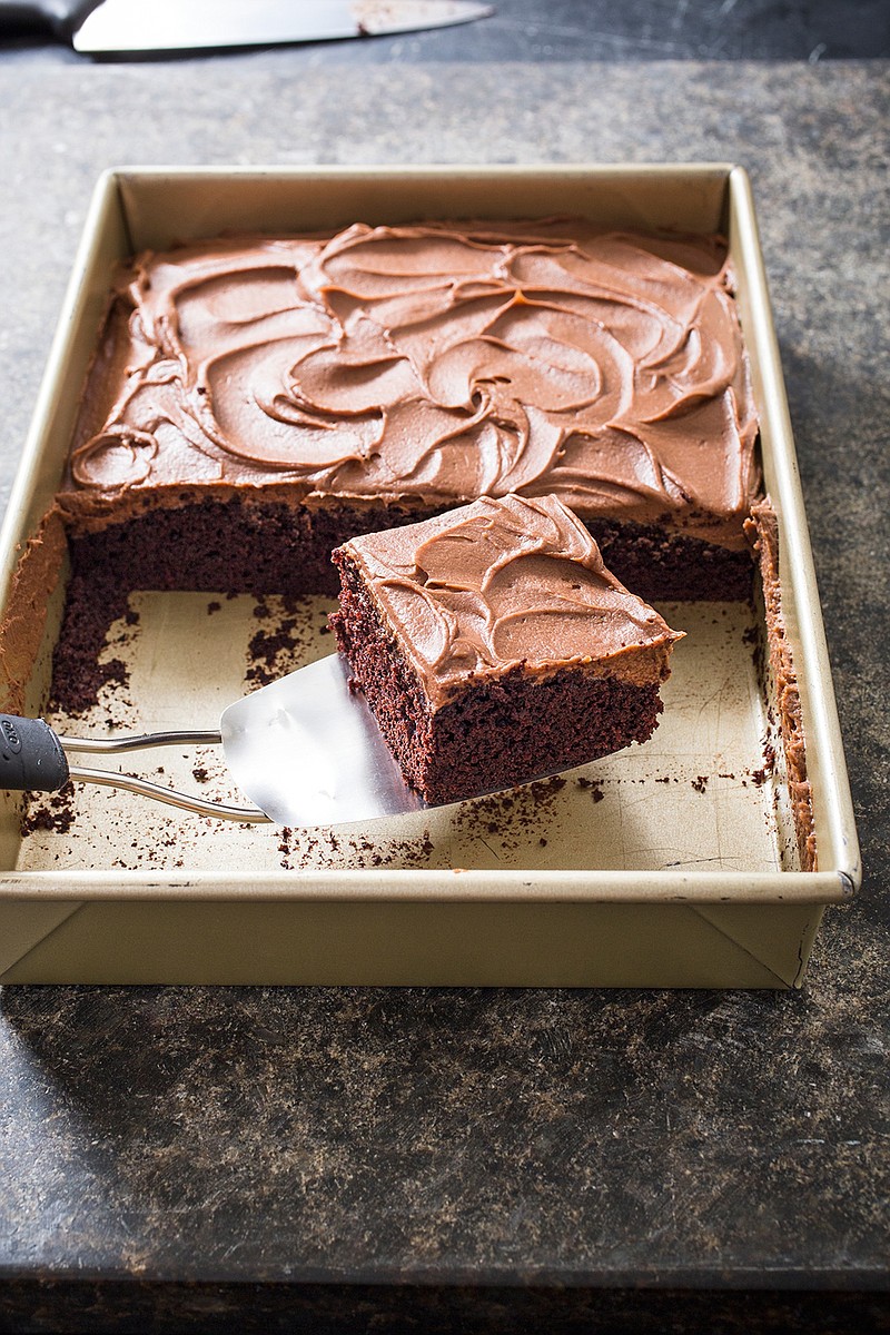 This undated photo provided by America's Test Kitchen in November 2018 shows a chocolate sheet cake in Brookline, Mass. This recipe appears in the "Complete Cookbook for Young Chefs." (Carl Tremblay/America's Test Kitchen via AP)