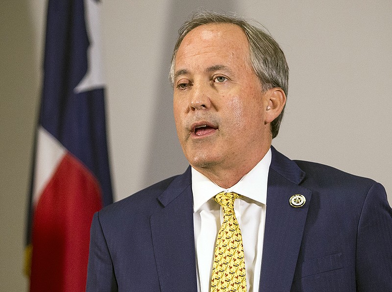 In this May 1, 2018, file photo, Texas Attorney General Ken Paxton speaks at a news conference in Austin, Texas. The Texas Court of Criminal Appeals on Wednesday, Nov. 21, 2018, handed a loss to prosecutors trying to bring the indicted Paxton to trial on charges of securities fraud, throwing the long running-criminal case into new doubt. The court ruled that payments approved to special prosecutors were set beyond legal limits. Prosecutors have previously threatened to quit the case if they're not paid more than $200,000 they say they're owed. (Nick Wagner/Austin American-Statesman via AP, File)