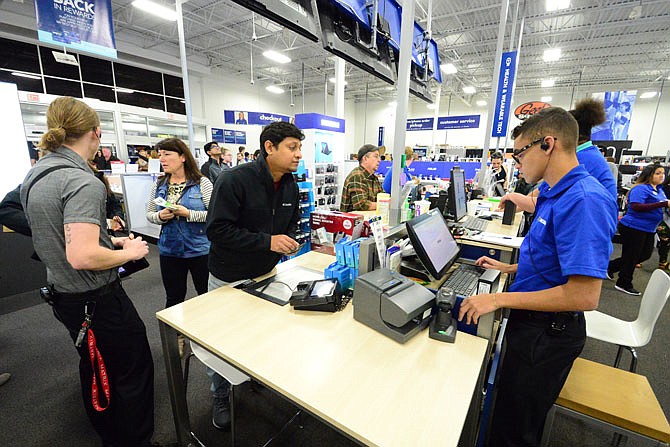 Black Friday shoppers, hunting for gifts, get a head start on the holidays at Best Buy on Thursday evening. 