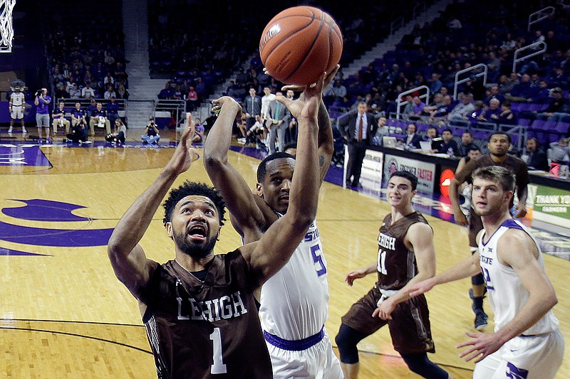 Lehigh's Jeameril Wilson (1) shoots under pressure from Kansas State's Barry Brown Jr. (5) during the first half of an NCAA college basketball game Saturday, Nov. 24, 2018, in Manhattan, Kan. (AP Photo/Charlie Riedel)