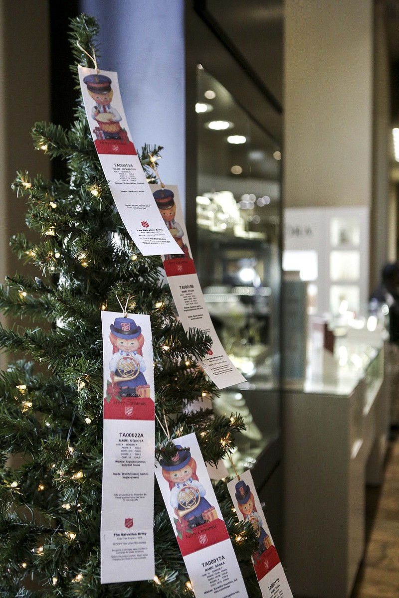 A Salvation Army Angel tree stands inside of the Crocker's Jewelers on Saturday in Texarkana, Texas. The program allows people of the community to "adopt" a needy child for Christmas and provide presents. 