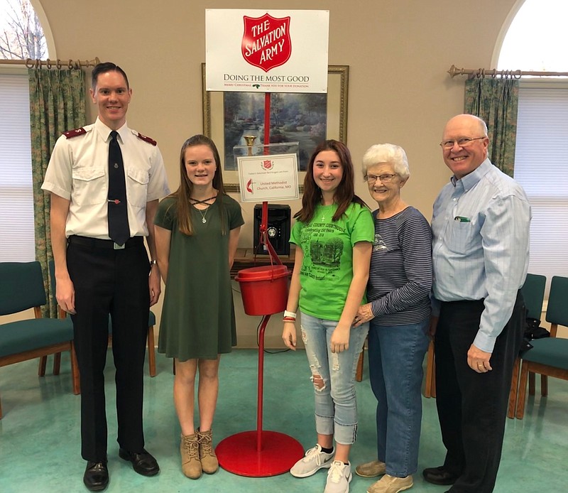 Alayna Butts, center left, and Cadence Winkler, center right, will soon post kettle bells for The Salvation Army in front of Cal's and C and R from Dec. 1-22, 2018. This charitable cause will be the first of its kind in California.