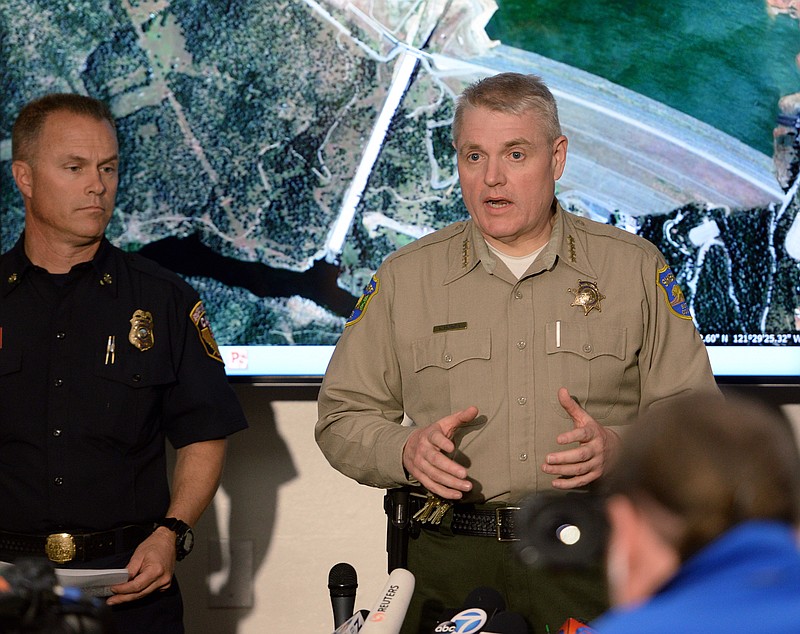 FILE - In this Feb. 13, 2017, file photo, Butte County Sheriff Kory Honea talks about mandatory evacuations due to the Oroville Dam disaster during a news conference in Oroville, Calif. The Northern California sheriff’s popularity is growing after playing a central role in two major crises. Honea ordered the evacuation of thousands of residents as a wildfire roared through the town of Paradise in Nov. 2018. He also told people living downstream of a dam to flee last year as a spillway threatened to collapse and flood communities. (Bill Husa/The Chico Enterprise-Record via AP, File)