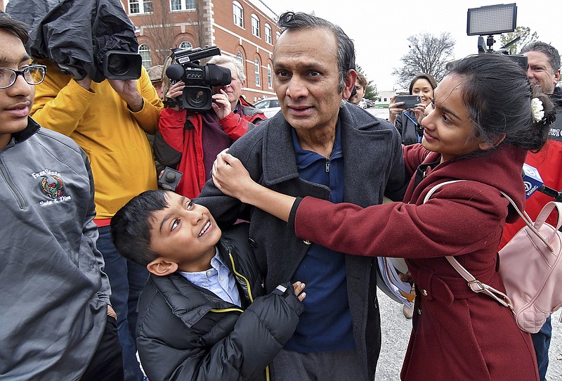 FILE - In this March 20, 2018, file photo, Syed Jamal is surround by his children, from left, Taseen Jamal, 14, Fareed Jamal, 7, and Naheen Jamal, 12, after he was released from the Platte County jail in Platte City, Kan., following a federal judge's order, pending the outcome of his deportation case. The case against Jamal, who is fighting deportation to his native Bangladesh will go on until at least 2022. A judge set the next hearing in the case for April 27, 2022. (John Sleezer/The Kansas City Star via AP, File)