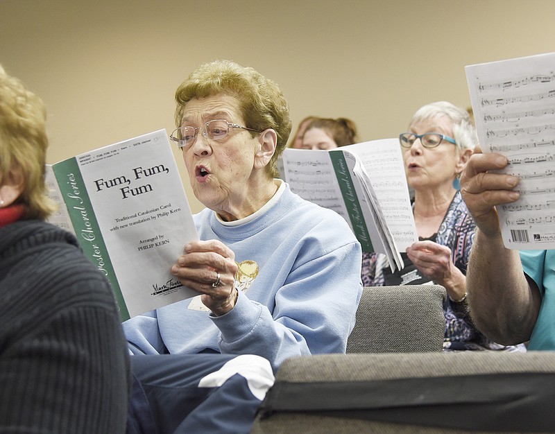 Lois Gershefske sings "Fum Fum Fum" while rehearsing last week for the Jefferson City Cantorum's Christmas concert "Greeting the Season" at First Baptist Church. The concert will be Dec. 8 at the Miller Performing Arts Center.