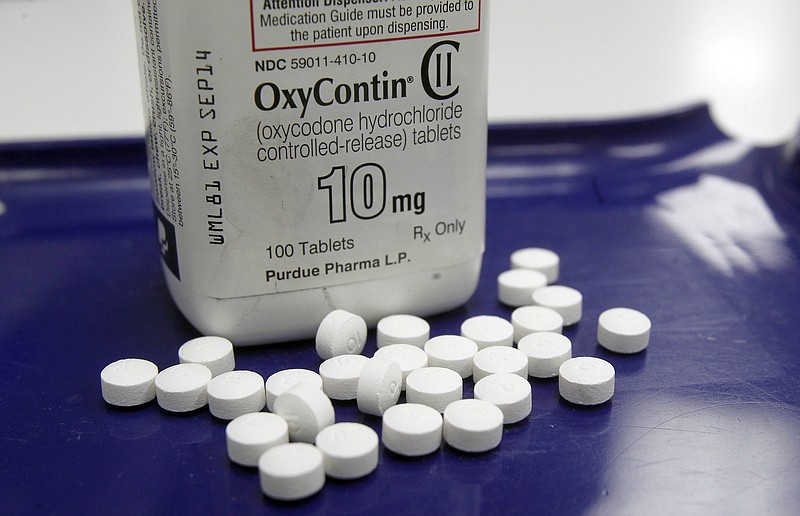 AP FILE: OxyContin pills are arranged for a photo at a pharmacy in Montpelier, Vt.  