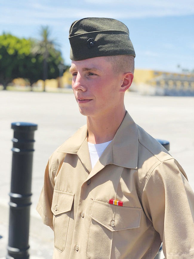 Solomon Huff is seen dressed in his uniform. 