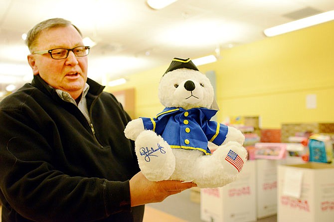 Toys for Tots volunteer Harold Faughn holds a "Ted-Tea Bear" on Wednesday donated by political commentator Rush Limbaugh to the Cole County Toys for Tots headquarters space in the Capital Mall. Faughn mentioned he also hopes to see more donations throughout the month as there is currently a shortage of toys for girls in the 3-5 and 6-8 age group as well as toys for boys in the 1-2 age group. 