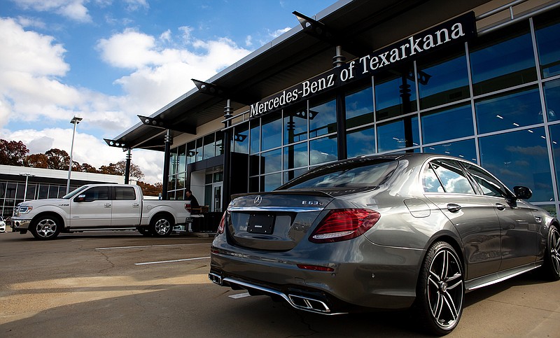 A Mercedes-Benz sits at the main entrance of Mercedes-Benz of Texarkana on Thursday during its grand opening. The newly expanded building was remodeled to Mercedes' standards with the parts department being in-house. The local business has increased inventory by 60 percent.
