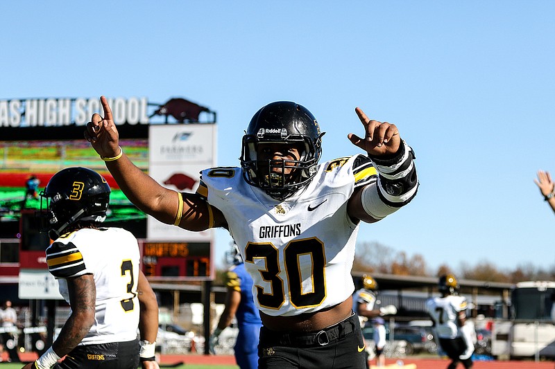 Griffons defensive lineman Marcus Brown celebrates after his team scores a touchdown against Southern Arkansas University Muleriders on Saturday at the Agent Barry Live United Bowl at Razorback Stadium in Texarkana, Ark. The Griffons won, 30-25.
