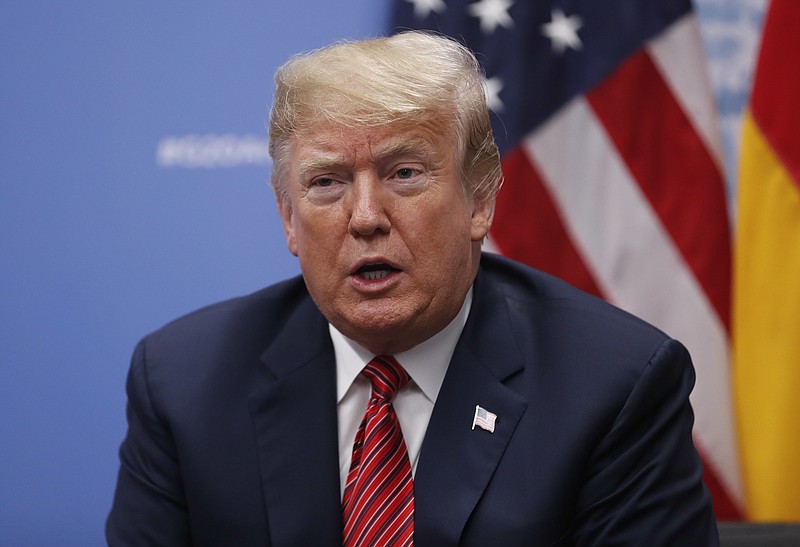 FILE - In this Dec. 1, 2018, file photo, President Donald Trump speaks to media at the G20 summit, in Buenos Aires, Argentina. Trump is keeping the pressure on congressional Democrats over funding for his promised border wall, but a partial government shutdown could be averted this week with a stopgap measure as negotiations continue. (AP Photo/Pablo Martinez Monsivais, File)