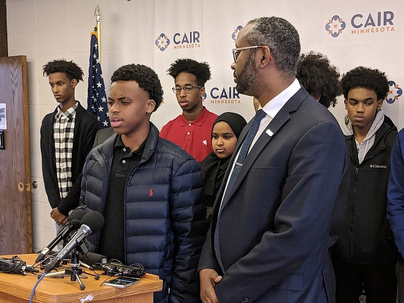 Billal Abdi and a group of teenagers, many of whom were in the Eden Prairie McDonalds the night of the incident, joined a press conference in Minneapolis to talk about their experience Monday, Dec. 3, 2018. Prosecutors on Monday charged a Minneapolis area man with a felony for allegedly pulling a gun on a group of young Somalis inside a McDonald’s last month. (Tim Nelson/Minnesota Public Radio via AP)