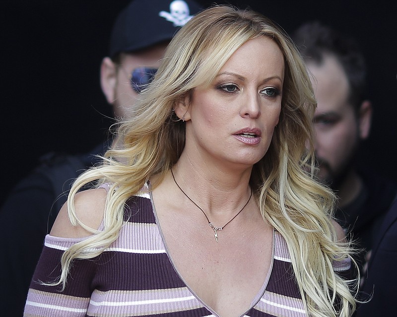 FILE - In this Oct. 11, 2018, file photo, adult film actress Stormy Daniels arrives for the opening of the adult entertainment fair "Venus," in Berlin. Attorneys for President Trump want a Los Angeles judge to award $340,000 in legal fees for successfully defending him against defamation claims by Daniels. Attorneys are due in Los Angeles federal court Monday, Dec. 3, to make their case that gamesmanship by Daniels’ lawyer led to big bills. (AP Photo/Markus Schreiber, File)