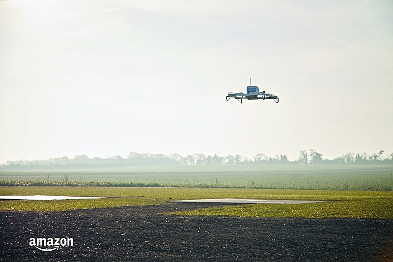 FILE- This Dec. 7, 2016, file photo provided by Amazon shows an Amazon Prime Air drone in Cambridgeshire, United Kingdom. Amazon founder and CEO Jeff Bezos might have underestimated regulatory obstacles and privacy concerns when he told CBS’ “60 Minutes” in December 2013 that his company would be making drone-borne deliveries within five years. (Amazon via AP, File)