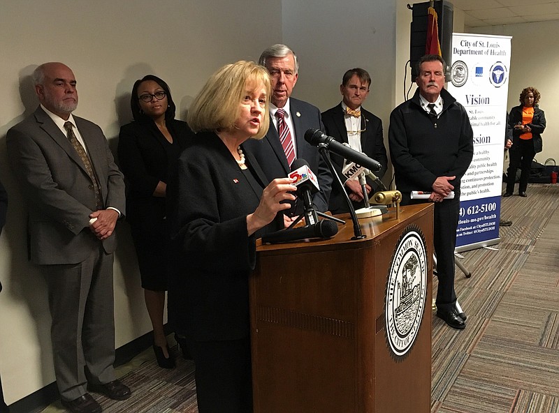 St. Louis Mayor Lyda Krewson speaks at a news conference in St. Louis on Wednesday, Dec. 5, 2018, with Missouri Gov. Mike Parsons and others looking on. Krewson and Parsons both are urging the Missouri Legislature to adopt a prescription drug monitoring plan to combat the opioid epidemic. (AP Photo/Jim Salter)