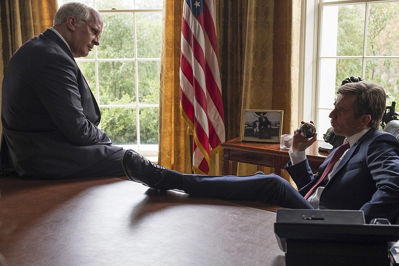 This image released by Annapurna Pictures shows Christian Bale as Dick Cheney, left, and Sam Rockwell as George W. Bush in a scene from "Vice."  On Thursday, Dec. 6, 2018, the film was nominated for a Golden Globe award for best motion picture musical or comedy. The 76th Golden Globe Awards will be held on Sunday, Jan. 6. (Matt Kennedy/Annapurna Pictures via AP)