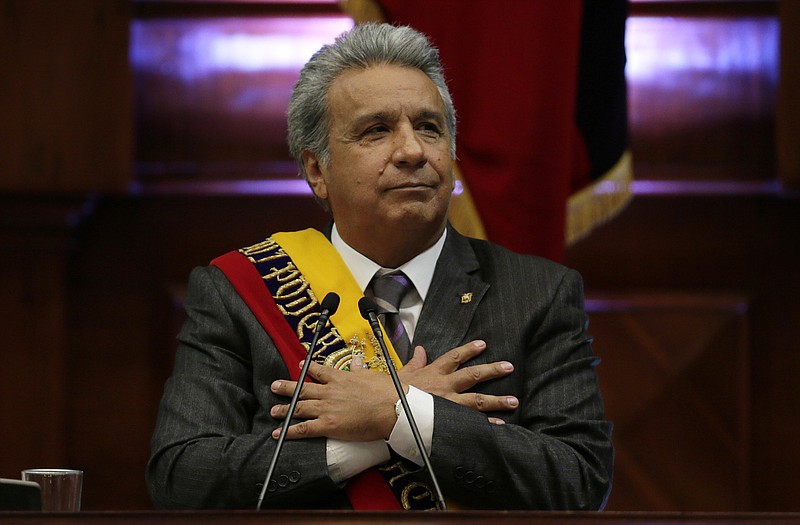 FILE - In this May 24, 2018 file photo, Ecuador's President Lenin Moreno delivers his first, annual state-of-the-nation address inside the National Assembly in Quito, Ecuador. Moreno said in a radio interview Thursday, Dec. 6, 2018, that Britain has provided sufficient guarantees for Assange to leave his government’s embassy in London, where the WikiLeaks founder has been living under asylum since 2012. (AP Photo/Dolores Ochoa, File)