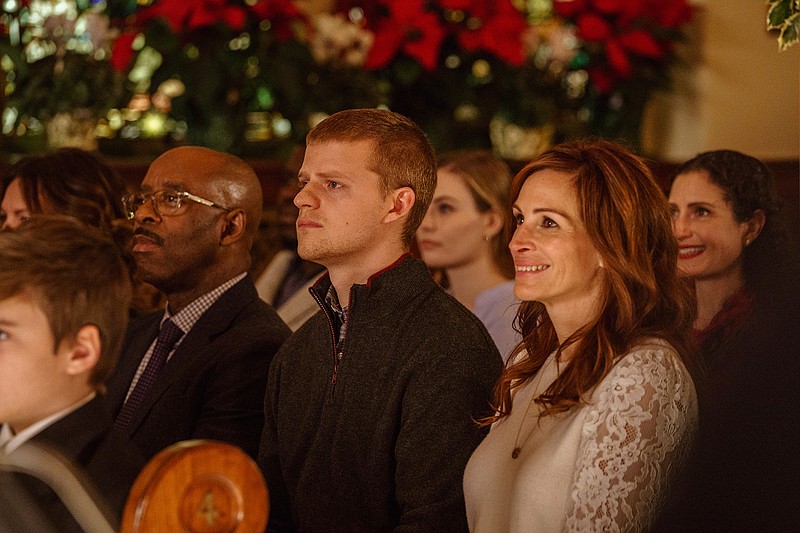 This image released by Roadside Attractions shows, from left, Courtney B. Vance, Lucas Hedges and Julia Roberts in a scene from "Ben is Back." (Mark Schafer/Roadside Attractions via AP)